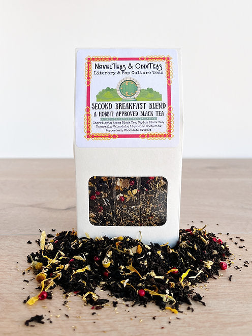 Second breakfast package surrounded by loose tea leaves